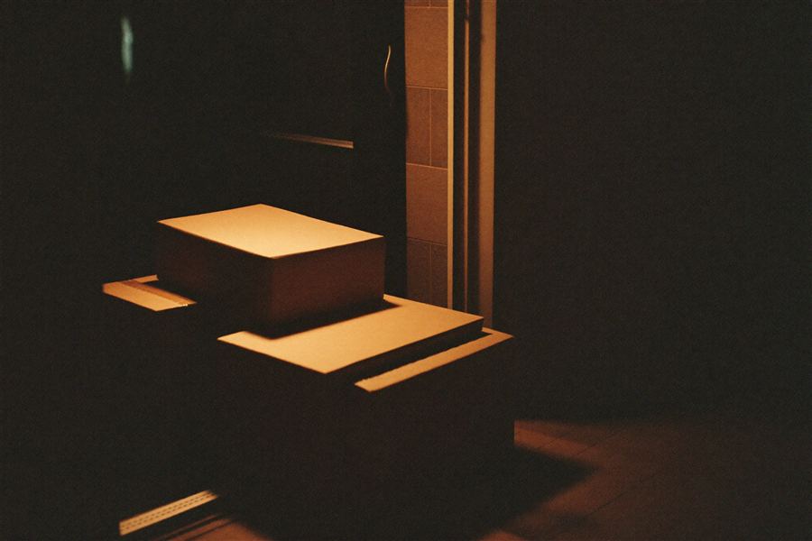 Stacked parcels lit by warm light at night