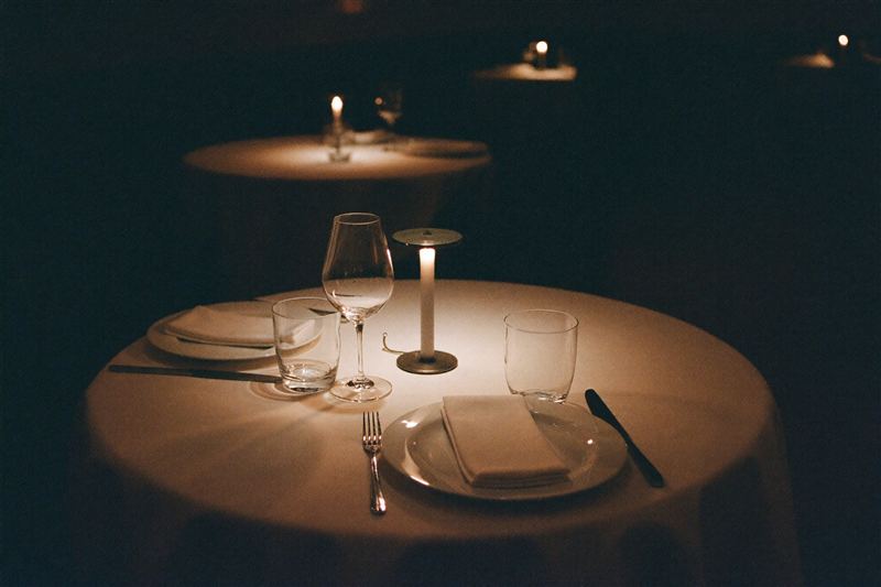 Elegant candlelit restaurant table setting